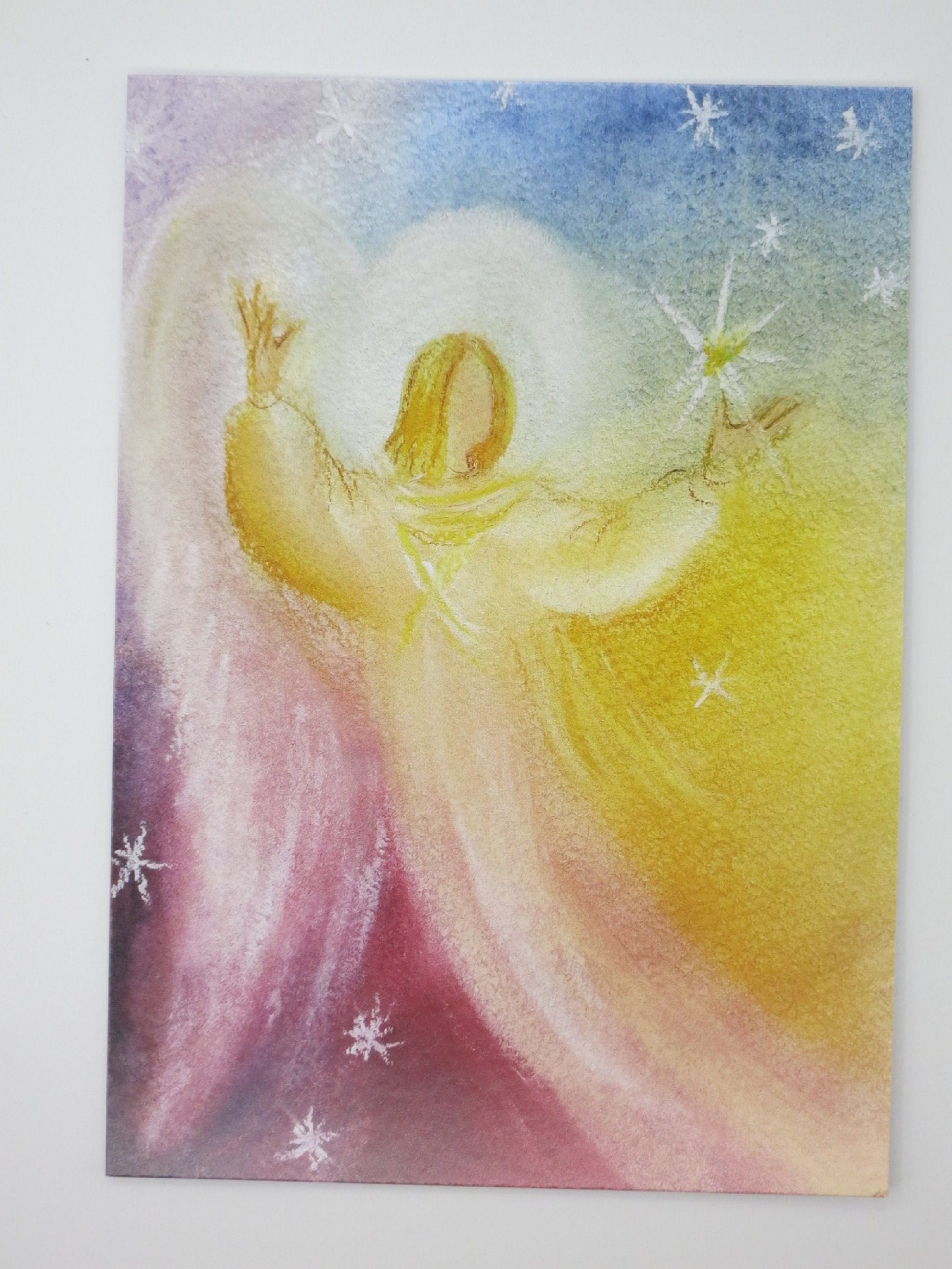 Weihnachtsengel-Karte: Engel greift nach leuchtendem Stern, Postkarte von Natalya Yeschenko