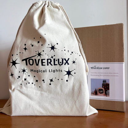 Verpackung der Toverlux Lampe mit Stoffbeutel Magical Lights und Geschenkkarton
