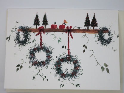 Weihnachtskarte fünf Kränze an einem Ast mit Vogel und Äpfeln