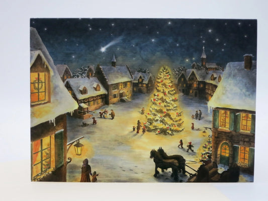 Weihnachtskarte mit Umschlag 'Weihnacht im Dorf' von Raphaela Berendt: verschneites Dorf bei Nacht mit beleuchtetem Weihnachtsbaum und Pferdeschlitten.