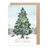 Weihnachtskarte mit Umschlag 'Eichhörnchen mit Tannenbaum' von Anna Inspira: beleuchteter Weihnachtsbaum in verschneiter Landschaft mit Eichhörnchen und Vögeln.