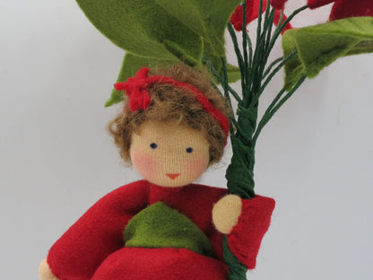Weihnachtsstern Blumenkind, Nahaufnahme Gesicht mit rotem Haarband – Jahreszeitentisch, Art. WI33